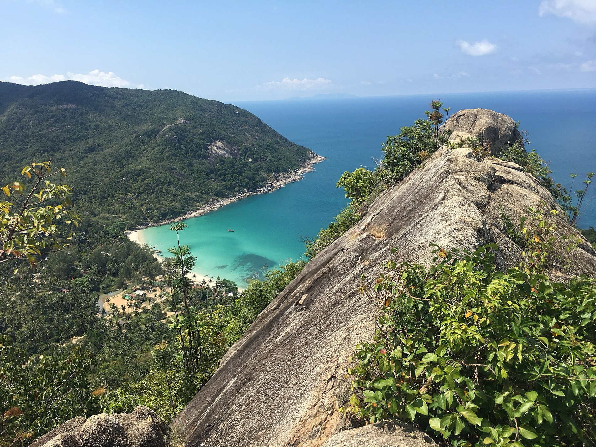 The turquoise water and white sand of a north Koh Phangan beach
