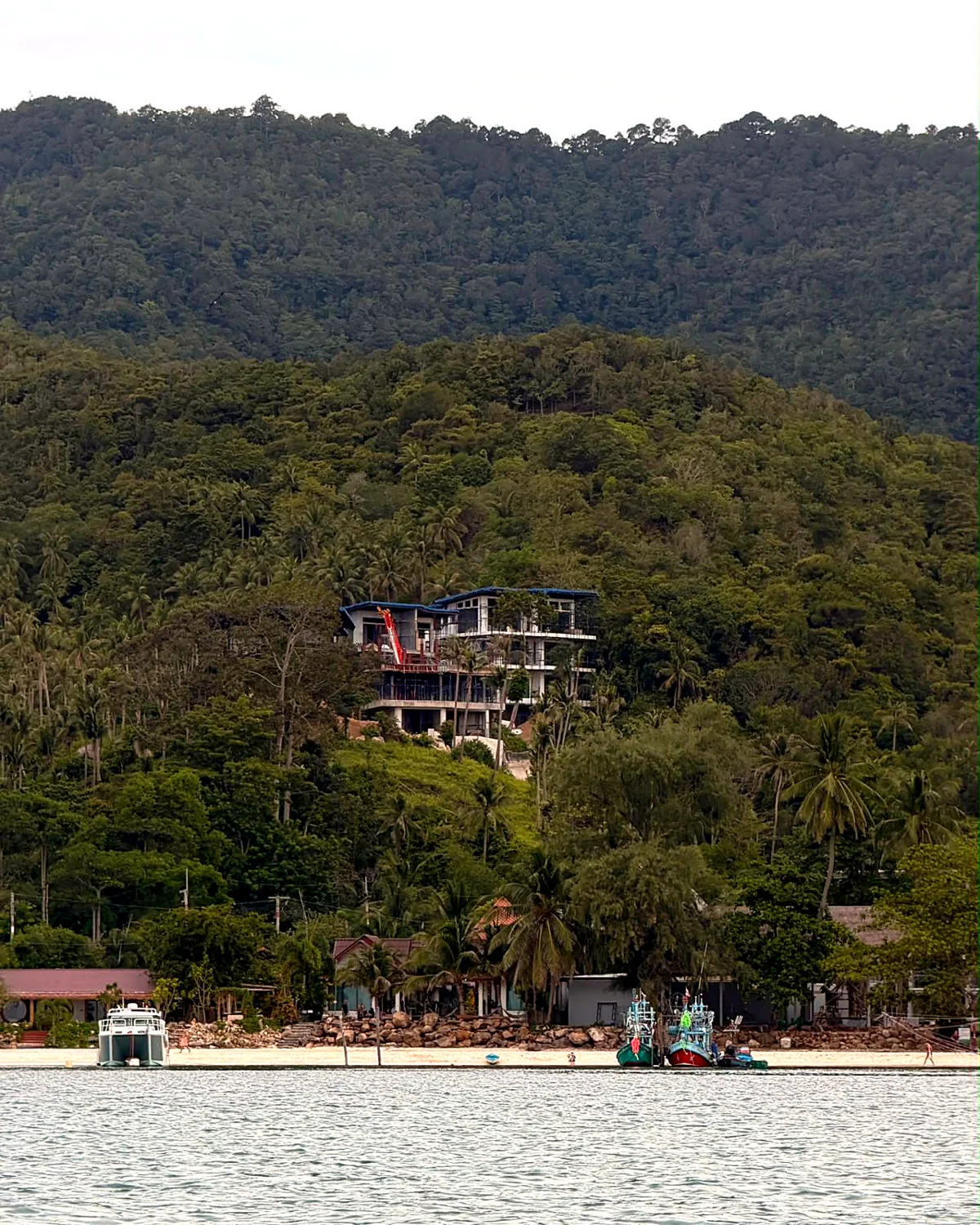 Gaia under construction on the hillside, seen from Chaloklum Bay
